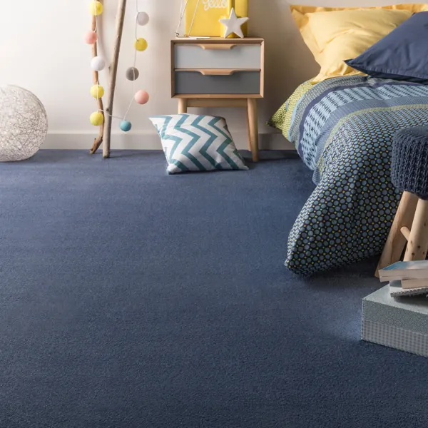 Blue plush carpet in modern bedroom