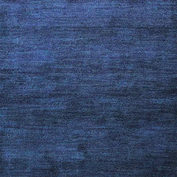 Navy blue woven carpet flooring with subtle texture